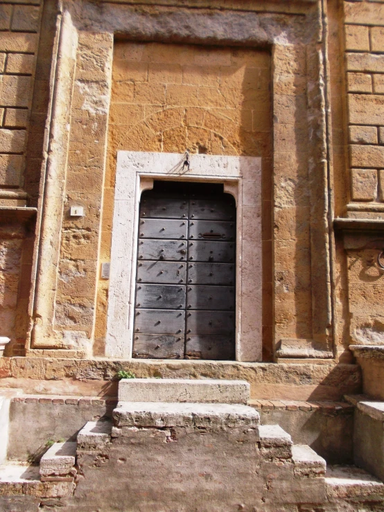 there is a doorway leading to an old building