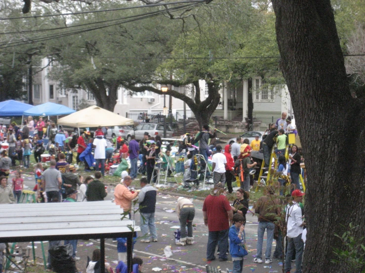 a crowd of people standing around an outdoor area