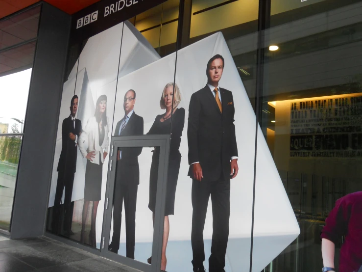 a business center is displaying images of people in suits