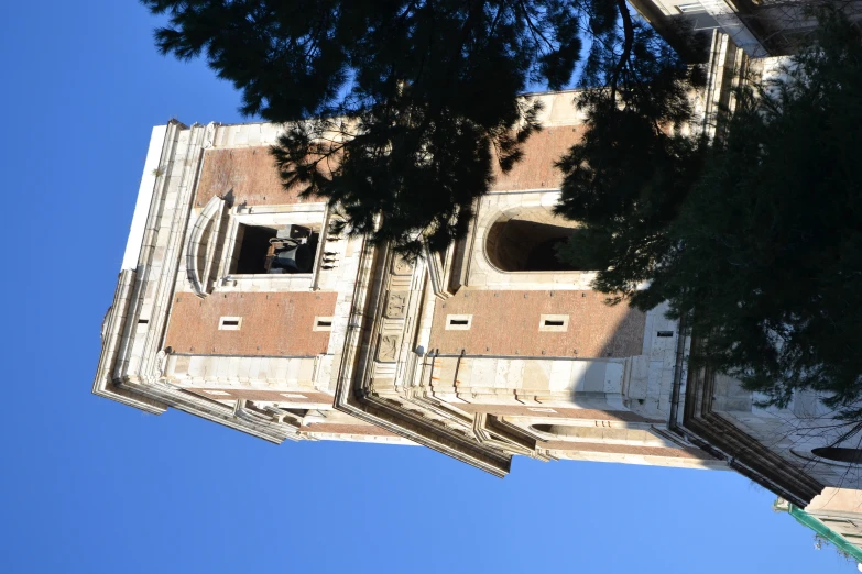 a tall clock tower with a few clocks on each of it's sides