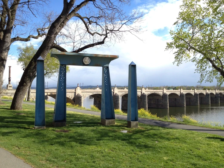 the archways in the park have clock faces and numbers