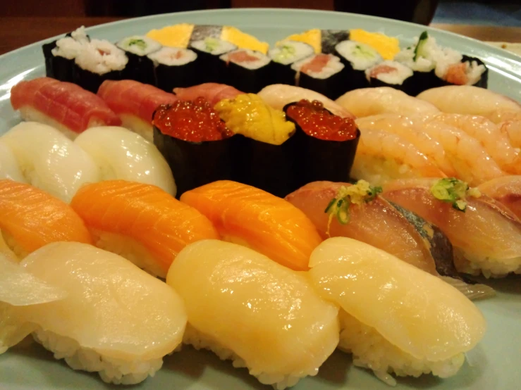 a plate with different types of sushi on it