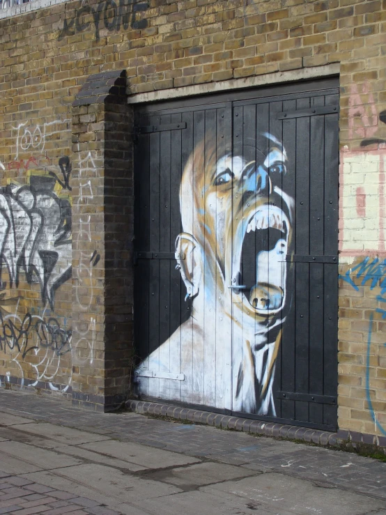 graffiti on a wall of a person on a door