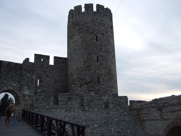 the old castle has a bridge that goes around the base