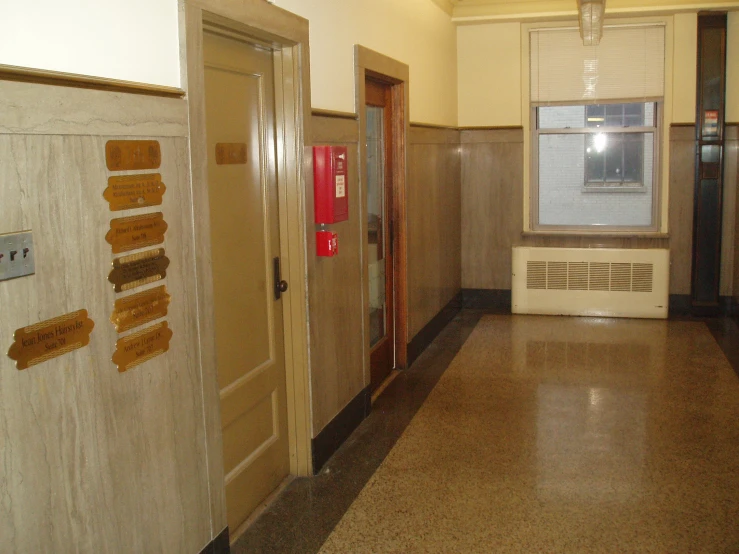 two empty rooms are shown with wooden doors