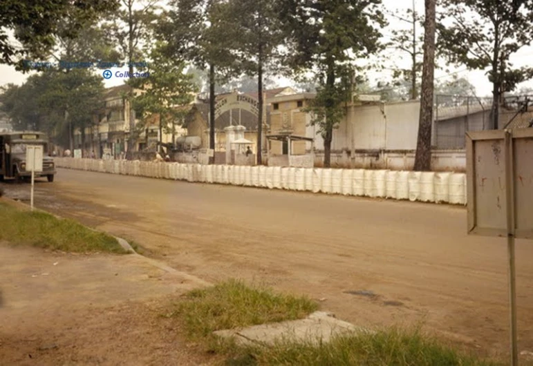 an old truck is driving along the street