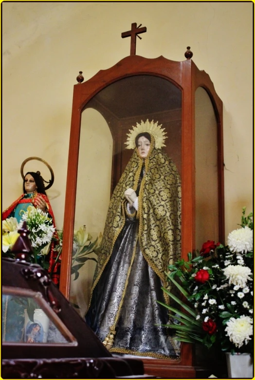 this catholic statue is displayed with religious figures