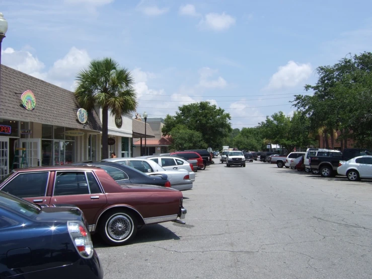 the parked cars are lined up in the parking lot