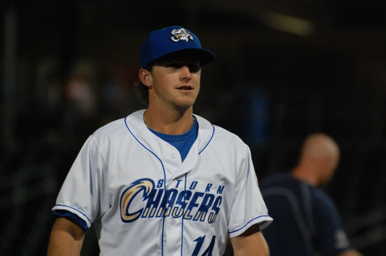 a baseball player standing in the batters box in a baseball game