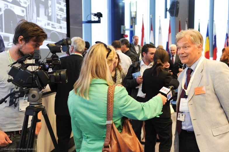 a group of people are in an area with camera equipment