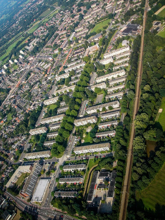 an aerial s of some houses in a forest