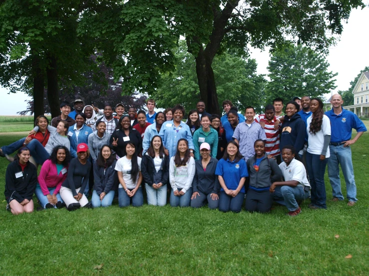 a large group of people are gathered in a field