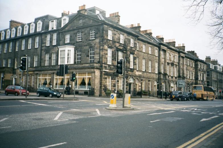 an old building on the corner of the street