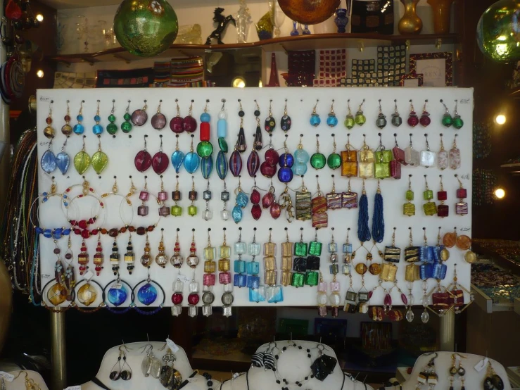 a large framed jewelry display in a store