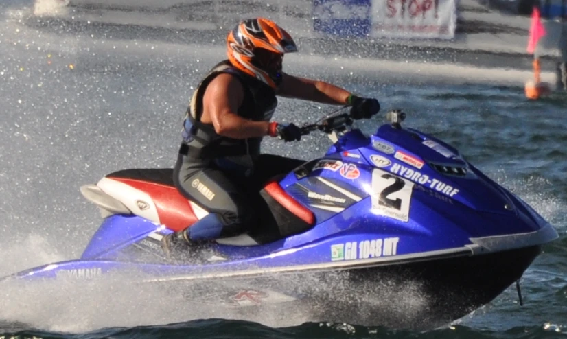 a person rides a jet ski on the water