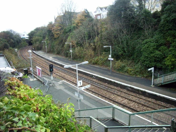 a view from a hill looking out at a train track