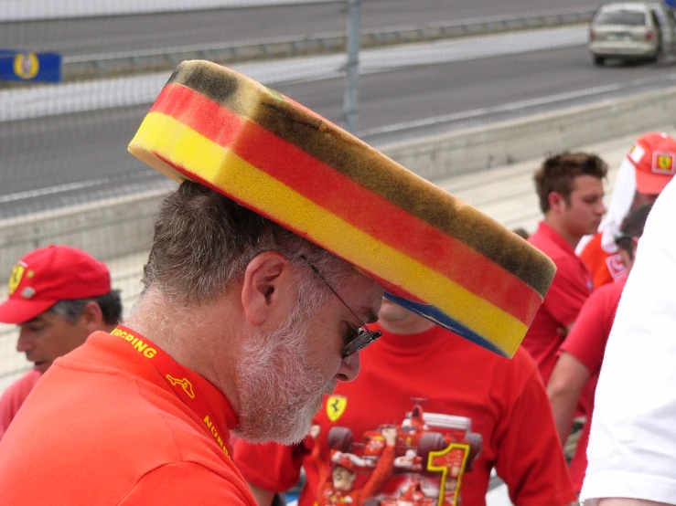 a man wearing a fireman's hat in the race