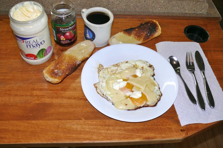 a plate with food on top of it next to two mugs