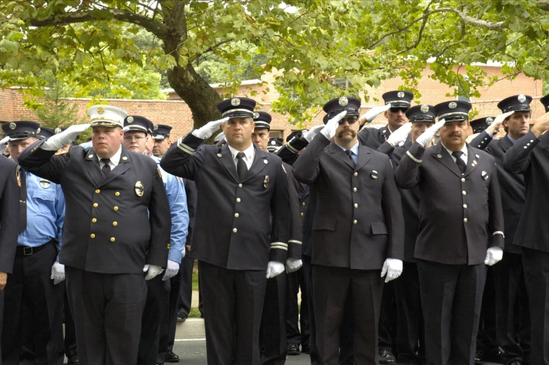 a group of uniformed men standing next to each other