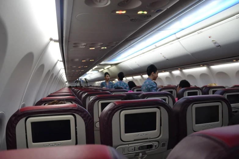 a view of the inside of an airplane from the seats