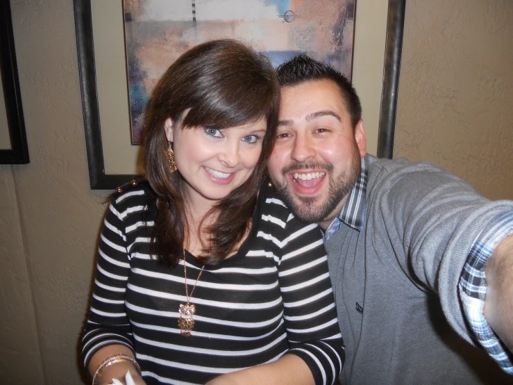 the man and woman are posing for a picture