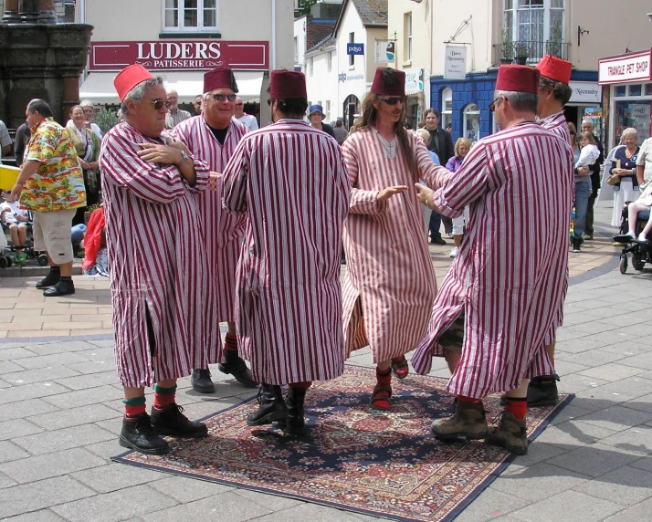 a bunch of people that are standing on the street