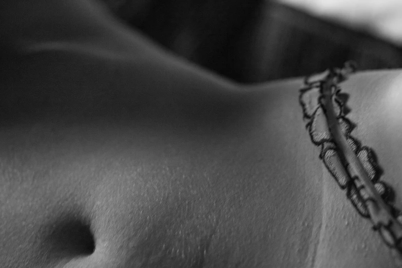closeup of a woman with  and a tattoo on her back