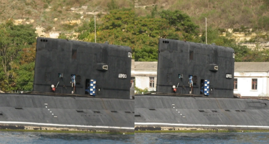 two black military boats sitting side by side