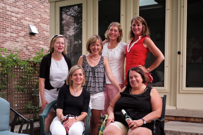 a group of women are posing together for a po