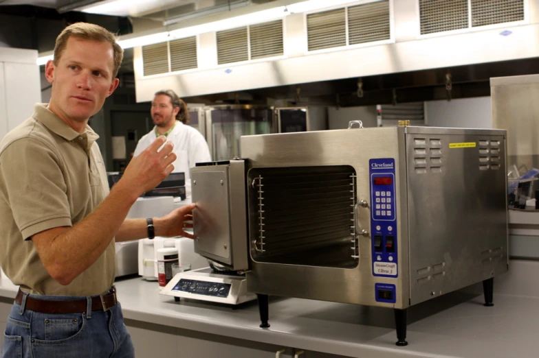 two chefs prepare meals for someone in the kitchen