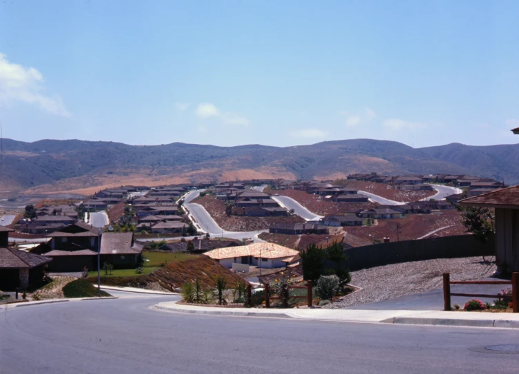 a neighborhood with a road lined with homes