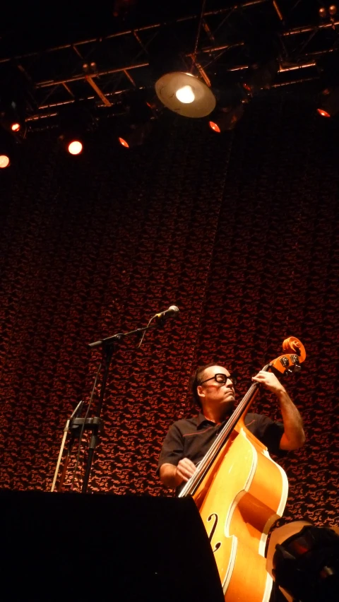 man playing the guitar at an event