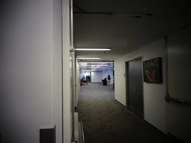 hallway inside the building with door leading to the other end