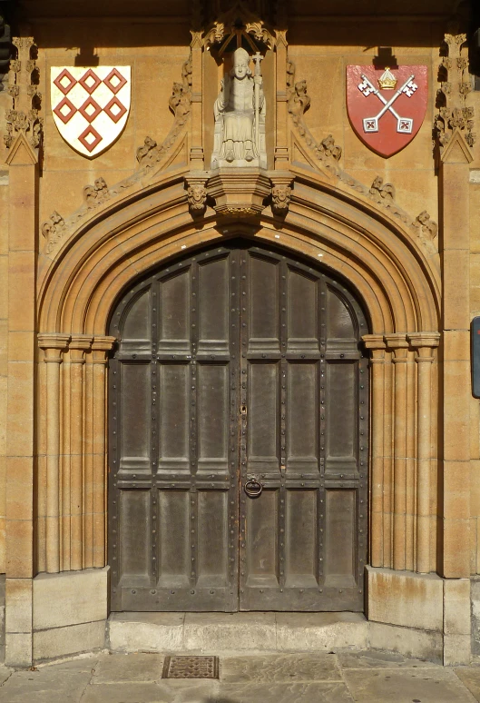a very old looking doorway with some crests