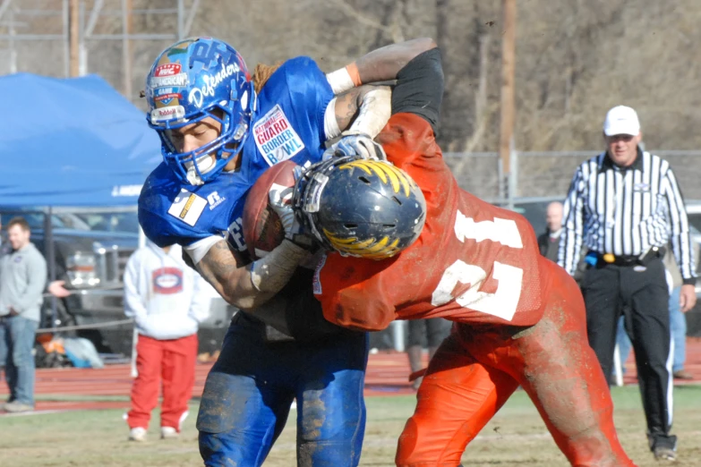 two teams playing football at the high school