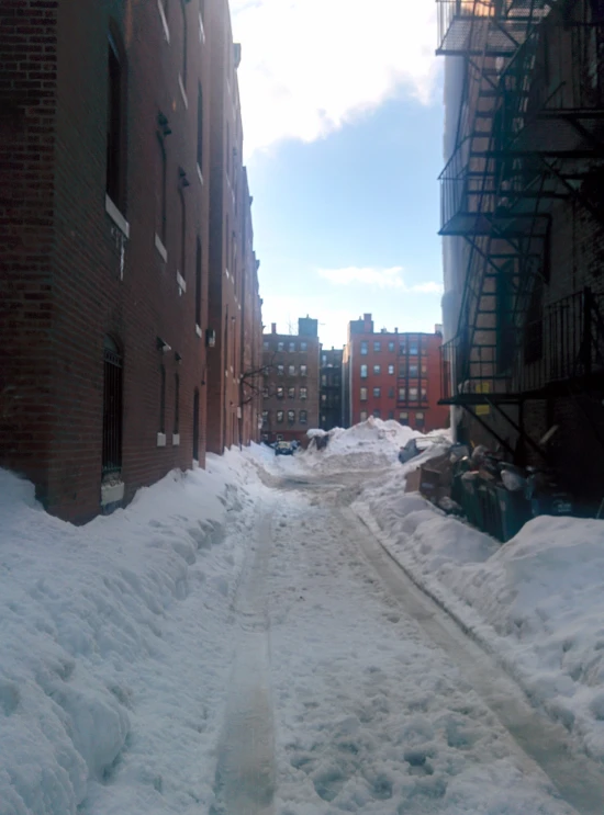 street in front of building with snow all around