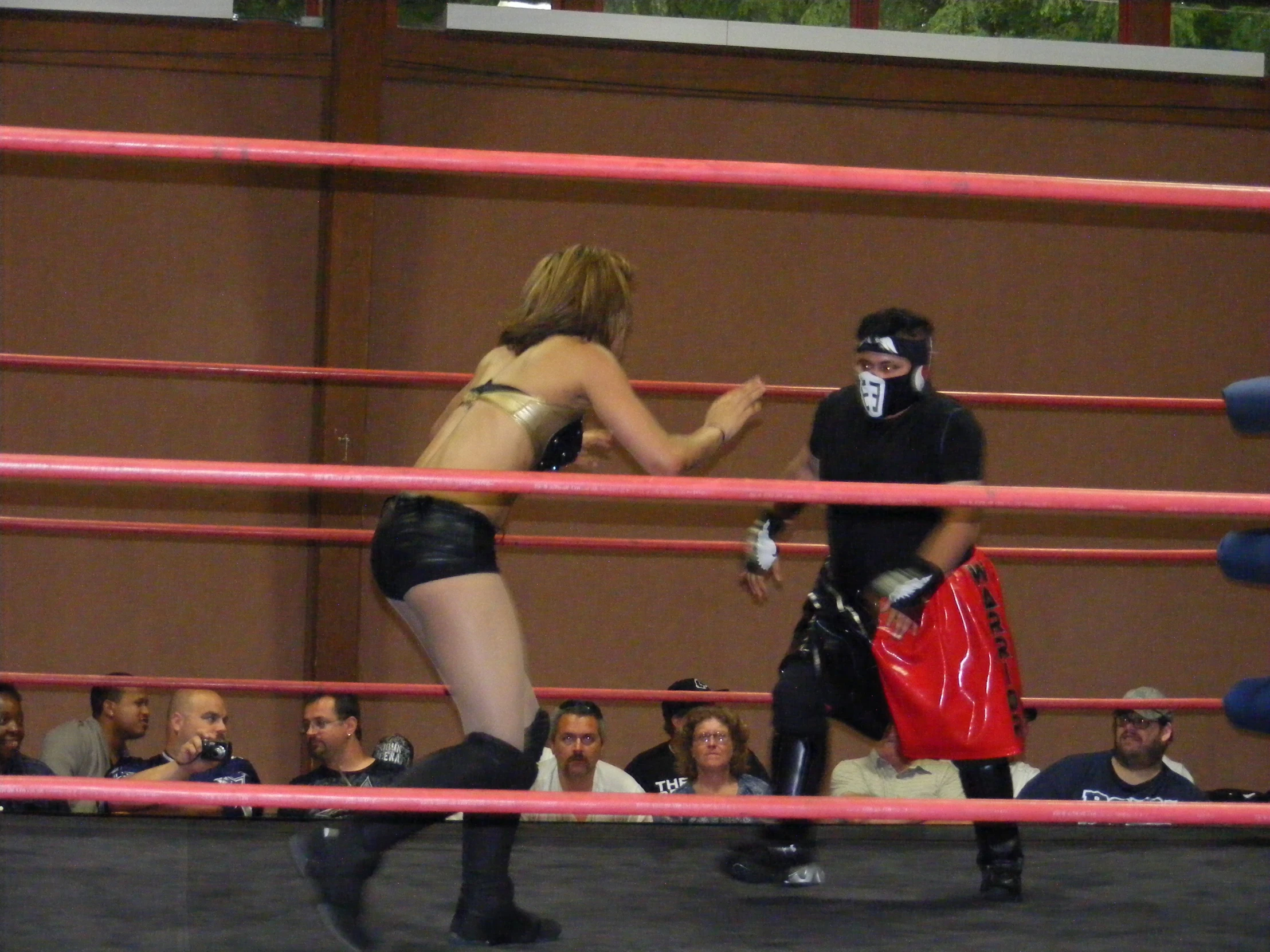 two women are in the ring during a competition