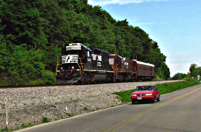 there is a train going down the tracks on the tracks