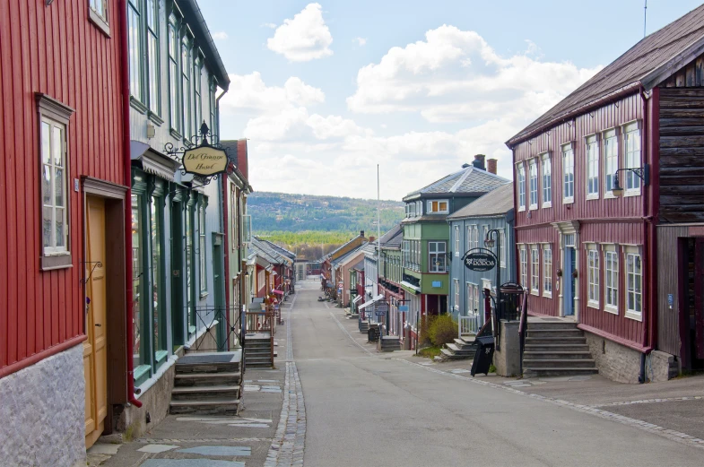 small town buildings line a small street in an area