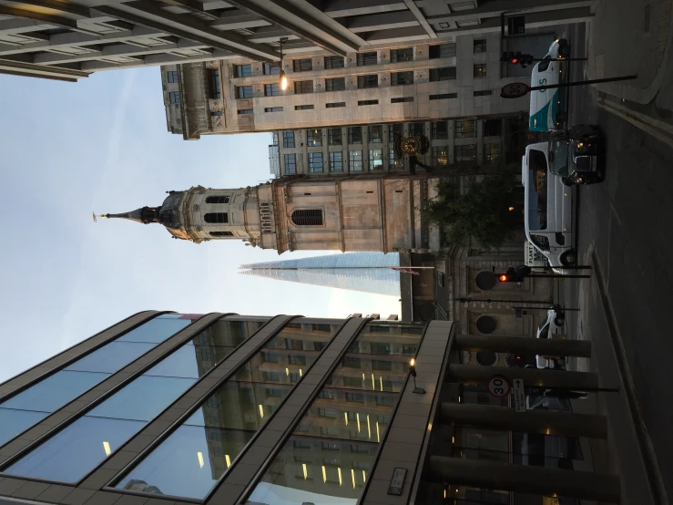 a very tall clock tower next to some buildings