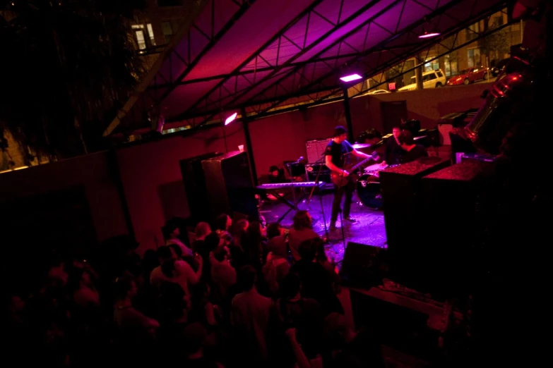 a band plays on stage in front of an audience