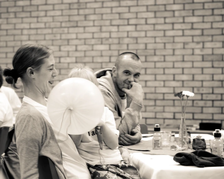 a man and woman sitting at a table