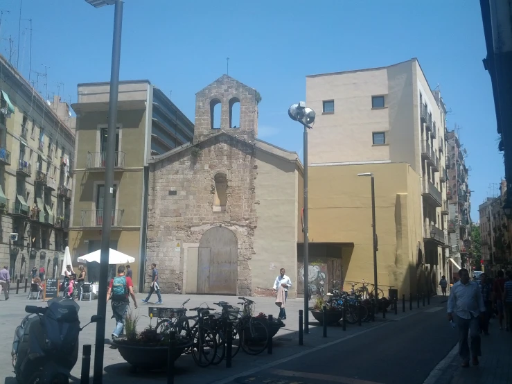 a couple of people walk down a city street