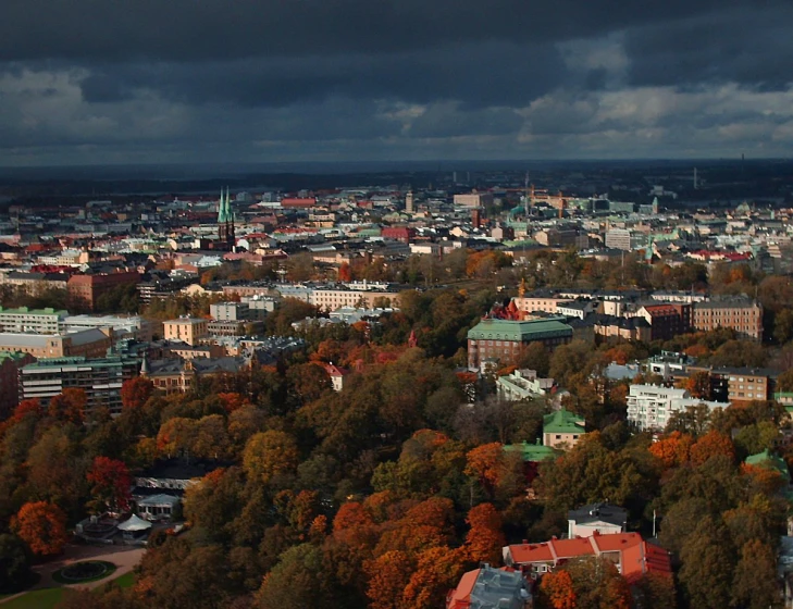 view of a city with lots of buildings and trees