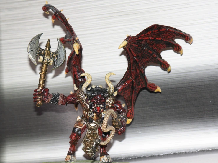 a red and black warhammer with two axes