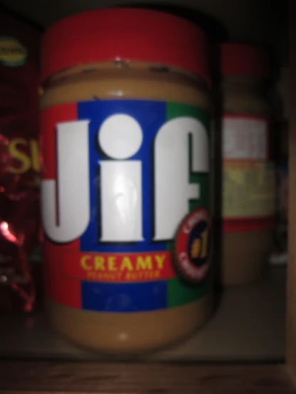 a jar of peanut er sitting on top of a shelf
