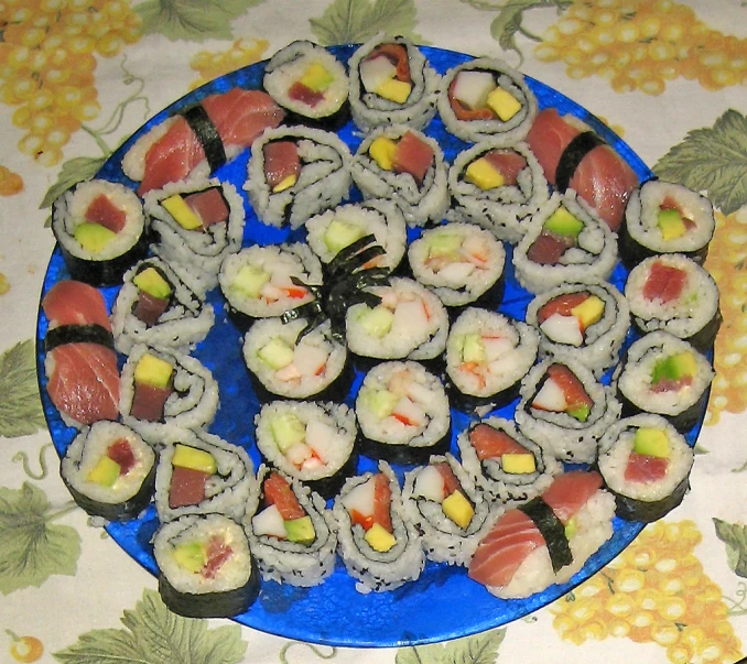 a plate full of sushi that is ready to eat