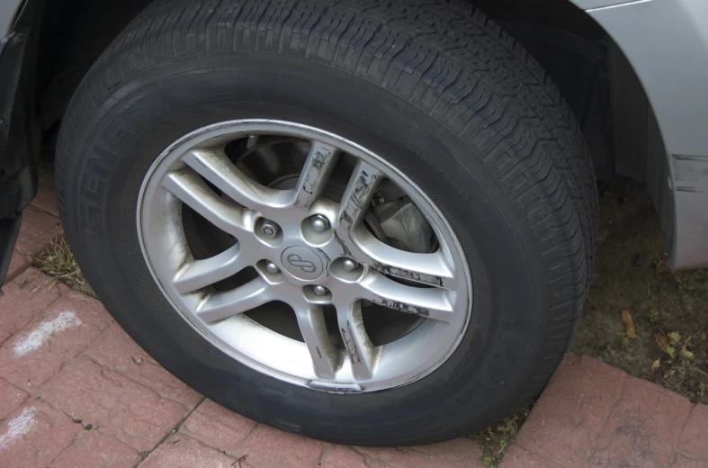 a close up of a car tire with silver rim