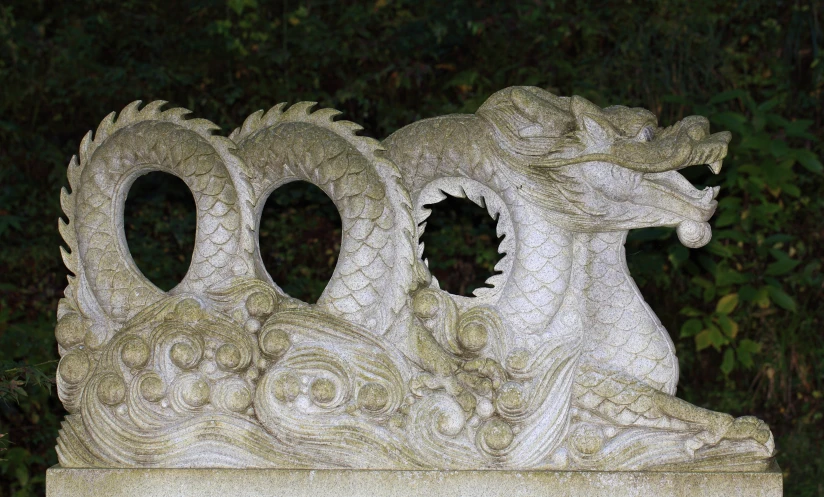 this is a dragon statue in a cemetery