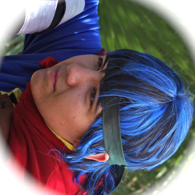a close up of a person with blue hair